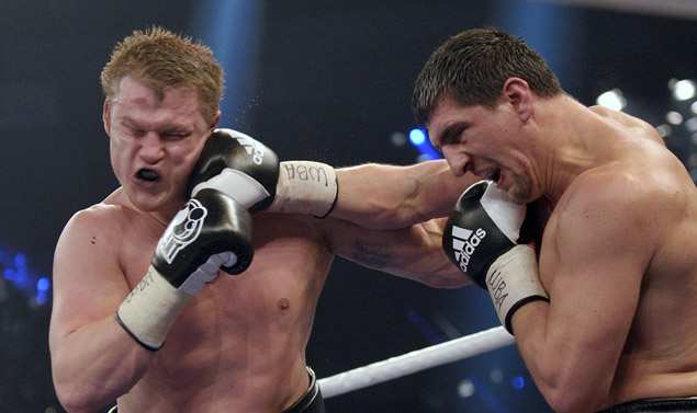 German Marco Huck (R) punches Russian ti